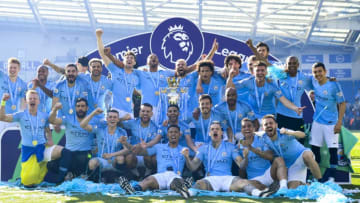 BRIGHTON, ENGLAND - MAY 12: Manchester City pose with the Premier League trophy after the Premier League match between Brighton & Hove Albion and Manchester City at American Express Community Stadium on May 12, 2019 in Brighton, United Kingdom. (Photo by Michael Regan/Getty Images)