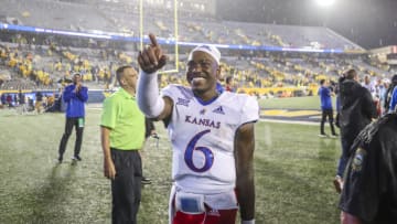 Sep 10, 2022; Morgantown, West Virginia, USA; Kansas Jayhawks quarterback Jalon Daniels (6) celebrates after defeating the Kansas Jayhawks at Mountaineer Field at Milan Puskar Stadium. Mandatory Credit: Ben Queen-USA TODAY Sports