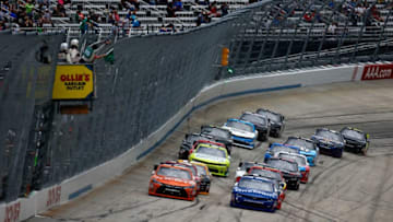 DOVER, DE - MAY 14: Daniel Suarez, driver of the #19 ARRIS Toyota, and Elliott Sadler, driver of the #1 OneMain Chevrolet, take the green flag to start the NASCAR XFINITY Series Ollie's Bargain Outlet 200 Heat #2 at Dover International Speedway on May 14, 2016 in Dover, Delaware. (Photo by Jonathan Ferrey/Getty Images)