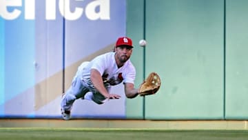 Jun 17, 2016; St. Louis, MO, USA; St. Louis Cardinals center fielder Randal Grichuk (15) dives and catches a ball hit by Texas Rangers right fielder Shin-Soo Choo (not pictured) during the first inning at Busch Stadium. Mandatory Credit: Jeff Curry-USA TODAY Sports