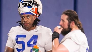 Florida Gators offensive lineman Micah Mazzccua (54) grabs some water between drills Tuesday. The University of Florida Football team held their 2023 Football Spring Practice Tuesday afternoon, March 7, 2023 at Sanders Football Practice Field at the University of Florida in Gainesville, FL. [Doug Engle/Ocala Star Banner]2023 tGai Uffootballspring2