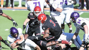 Devin Richardson (3) piles onto a running back as the New Mexico State Aggies face off against the Tarleton State Texans at the Sun Bowl in El Paso on Sunday, Feb. 21, 2021.Nmsu Ts 20