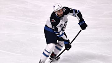 Apr 8, 2021; Montreal, Quebec, CAN; Winnipeg Jets defenseman Dylan DeMelo (2) makes a pass against the Montreal Canadiens during the third period at Bell Centre. Mandatory Credit: Jean-Yves Ahern-USA TODAY Sports