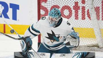 Nov 30, 2022; Toronto, Ontario, CAN; San Jose Sharks goaltender Aaron Dell (30) makes a save during warm up before a game against the Toronto Maple Leafs at Scotiabank Arena. Mandatory Credit: John E. Sokolowski-USA TODAY Sports