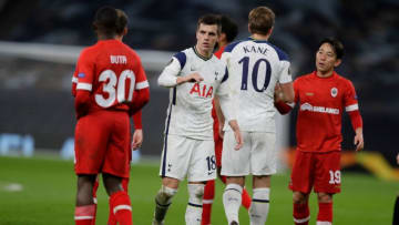 (L-R) Antwerp's Portuguese defender Aurelio Buta, Tottenham Hotspur's Argentinian midfielder Giovani Lo Celso, Tottenham Hotspur's English striker Harry Kane and Antwerp's Japanese midfielder Koji Miyoshi react at the final whistle during the UEFA Europa League 1st round Group J football match between Tottenham Hotspur and Antwerp at the Tottenham Hotspur Stadium in London, on December 10, 2020. (Photo by Kirsty Wigglesworth / POOL / AFP) (Photo by KIRSTY WIGGLESWORTH/POOL/AFP via Getty Images)