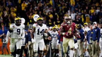 MIAMI GARDENS, FL - DECEMBER 30: Dalvin Cook #4 of the Florida State Seminoles carries the ball in the second half against the Michigan Wolverines during the Capitol One Orange Bowl at Sun Life Stadium on December 30, 2016 in Miami Gardens, Florida. (Photo by Chris Trotman/Getty Images)