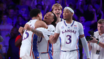 Nov 24, 2022; Paradise Island, BAHAMAS; Kansas Jayhawks guard Bobby Pettiford Jr. (0) celebrates with teammates after hitting the game winning shot in overtime against the Wisconsin Badgers at Imperial Arena. Mandatory Credit: Kevin Jairaj-USA TODAY Sports