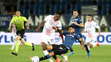 BERGAMO, ITALY - MAY 23: Rafael Leao of A.C. Milan is tackled by Cristian Romero of Atalanta B.C. during the Serie A match between Atalanta BC and AC Milan at Gewiss Stadium on May 23, 2021 in Bergamo, Italy. Sporting stadiums around Italy remain under strict restrictions due to the Coronavirus Pandemic as Government social distancing laws prohibit fans inside venues resulting in games being played behind closed doors. (Photo by Marco Luzzani/Getty Images)