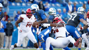 LEXINGTON, KY - NOVEMBER 25: Stephen Johnson #15 of the Kentucky Wildcats is sacked by Jonathan Greenard #58 of the Louisville Cardinals during the game at Commonwealth Stadium on November 25, 2017 in Lexington, Kentucky. (Photo by Andy Lyons/Getty Images)