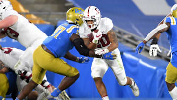 Auburn footballDec 19, 2020; Pasadena, California, USA; Stanford Cardinal running back Austin Jones (20) is stopped by UCLA Bruins defensive lineman Odua Isibor (97 after a short gain in the first half of the game at the Rose Bowl. Mandatory Credit: Jayne Kamin-Oncea-USA TODAY Sports
