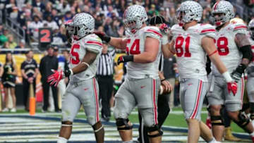 Jan 1, 2016; Glendale, AZ, USA; Ohio State Buckeyes running back Ezekiel Elliott (15) celebrates with offensive lineman Billy Price (54) celebrate after scoring a touchdown in the first half against the Notre Dame Fighting Irish in the 2016 Fiesta Bowl at University of Phoenix Stadium. Mandatory Credit: Matt Kartozian-USA TODAY Sports