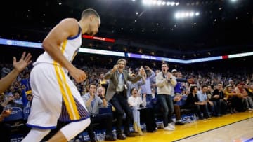 OAKLAND, CA - MARCH 16: Fans react after Stephen Curry