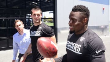 May 31, 2016; Alameda, CA, USA; Oakland Raiders quarterback Derek Carr (center) and safety Karl Joseph at organized team activities at the Raiders practice facility. Mandatory Credit: Kirby Lee-USA TODAY Sports