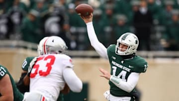 EAST LANSING, MI - NOVEMBER 10: Brian Lewerke #14 of the Michigan State Spartans throws a first half pass while playing the Ohio State Buckeyes at Spartan Stadium on November 10, 2018 in East Lansing, Michigan. (Photo by Gregory Shamus/Getty Images)