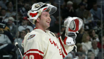 Martin Broduer #30 of the New Jersey Devils waves to family during the 54th NHL All-Star Game on February 8, 2004 at the Xcel Energy Center in St. Paul, Minnesota. (Photo by Harry How/Getty Images)