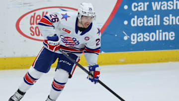 SYRACUSE, NY - APRIL 21: Mason Jobst #26 of Rochester Americans looks to pass against the Syracuse Crunch at Upstate Medical University Arena on April 21, 2023 in Syracuse, New York. (Photo by Isaiah Vazquez/Getty Images)