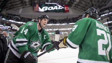 Oct 25, 2016; Dallas, TX, USA; Dallas Stars left wing Jamie Benn (14) and left wing Antoine Roussel (21) celebrate center Tyler Seguin (not pictured) goal against Winnipeg Jets during the third period at the American Airlines Center. The Stars defeat the Jets 3-2. Mandatory Credit: Jerome Miron-USA TODAY Sports