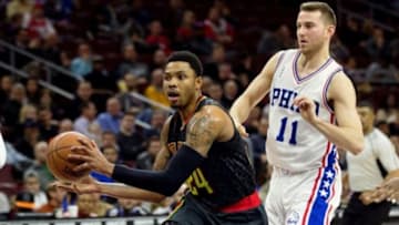 Feb 3, 2016; Philadelphia, PA, USA; Atlanta Hawks forward Kent Bazemore (24) drives past Philadelphia 76ers guard Nik Stauskas (11) during the first half at Wells Fargo Center. Mandatory Credit: Bill Streicher-USA TODAY Sports
