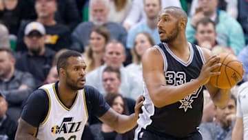 Feb 25, 2016; Salt Lake City, UT, USA; Utah Jazz forward Trevor Booker (33) defends against San Antonio Spurs center Boris Diaw (33) during the first half at Vivint Smart Home Arena. Mandatory Credit: Russ Isabella-USA TODAY Sports