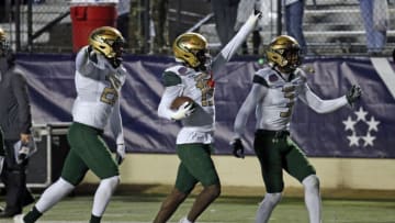 Dec 18, 2021; Shreveport, LA, USA; UAB Blazers defensive back Jaylen Key (left) and defensive back CD Daniels (right) react with defensive back Mac McWilliams (middle) after a fumble recovery during during the fourth quarter against the BYU Cougars the 2021 Independence Bowl at Independence Stadium. Mandatory Credit: Petre Thomas-USA TODAY Sports