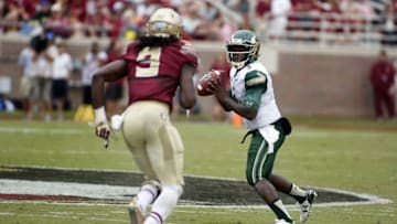 Sep 12, 2015; Tallahassee, FL, USA; South Florida Bulls quarterback Quinton Flowers (9) looks for a receiver while being pressured by Florida State Seminoles defensive end Josh Sweat (9) at Doak Campbell Stadium. Florida State won 34-14. Mandatory Credit: Glenn Beil-USA TODAY Sports
