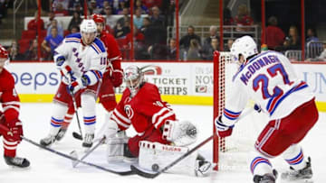 Mar 31, 2016; Raleigh, NC, USA; Carolina Hurricanes goalie Cam Ward (30) makes a save against New York Rangers defensemen Ryan McDonagh (27) in the third period at PNC Arena. The Hurricanes won 4-3. Mandatory Credit: James Guillory-USA TODAY Sports
