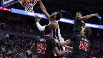 Oct 30, 2015; Auburn Hills, MI, USA; Detroit Pistons center Andre Drummond (0) makes a slam dunk between Chicago Bulls forward Tony Snell (20) forward Pau Gasol (16) and guard Jimmy Butler (21) during overtime at The Palace of Auburn Hills. Pistons win 98-94. Mandatory Credit: Raj Mehta-USA TODAY Sports