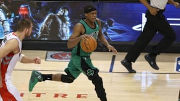 Mar 28, 2014; Toronto, Ontario, CAN; Boston Celtics guard Rajon Rondo (9) dribbles out of his own half against the Toronto Raptors at Air Canada Centre. The Raptors beat the Celtics 105-103. Mandatory Credit: Tom Szczerbowski-USA TODAY Sports