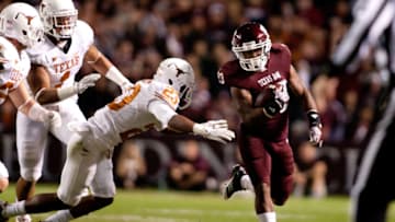 COLLEGE STATION, TX - NOVEMBER 24: Ben Malena #23 of the Texas A&M Aggies rushes against the Texas Longhorns in the first half of a game at Kyle Field on November 24, 2011 in College Station, Texas. (Photo by Darren Carroll/Getty Images)