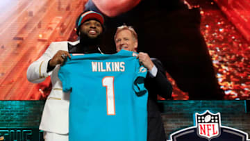 NASHVILLE, TENNESSEE - APRIL 25: Christian Wilkins of Clemson poses with NFL Commissioner Roger Goodell after being chosen #13 overall by the Miami Dolphins during the first round of the 2019 NFL Draft on April 25, 2019 in Nashville, Tennessee. (Photo by Andy Lyons/Getty Images)