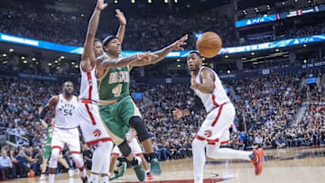 Mar 18, 2016; Toronto, Ontario, CAN; Boston Celtics guard Isaiah Thomas (4) passes against Toronto Raptors in the third quarter at Air Canada Centre. Raptors beat Celtics 105 - 91. Mandatory Credit: Peter Llewellyn-USA TODAY Sports