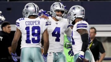 Amari Cooper #19, Dak Prescott #4, and Ezekiel Elliott #21 of the Dallas Cowboys (Photo by Ronald Martinez/Getty Images)