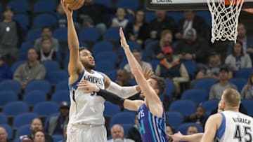 Nov 15, 2016; Minneapolis, MN, USA; Minnesota Timberwolves center Karl-Anthony Towns (32) shoots the ball over Charlotte Hornets center Frank Kaminsky III (44) in the fight half at Target Center. Mandatory Credit: Jesse Johnson-USA TODAY Sports