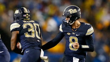 PITTSBURGH, PA - SEPTEMBER 08: Kenny Pickett #8 of the Pittsburgh Panthers hands off to Qadree Ollison #30 of the Pittsburgh Panthers against the Penn State Nittany Lions on September 8, 2018 at Heinz Field in Pittsburgh, Pennsylvania. (Photo by Justin K. Aller/Getty Images)