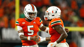 MIAMI GARDENS, FL - NOVEMBER 24: DeeJay Dallas #13 of the Miami Hurricanes celebrates with N'Kosi Perry #5 after scoring a touchdown against the Pittsburgh Panthers during the second half at Hard Rock Stadium on November 24, 2018 in Miami Gardens, Florida. (Photo by Michael Reaves/Getty Images)