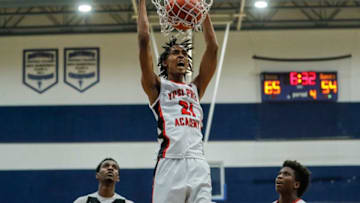 Emoni Bates, Texas Basketball, Ypsi Prep forward Emoni Bates (21) dunks against SPIRE Academy during the second half at Central Academy in Ann Arbor, Saturday, March 13, 2021.