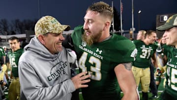 FT. COLLINS, CO - NOVEMBER 18: Colorado State head coach Mike Bobo, left, and Colorado State Rams linebacker Evan Colorito #43 celebrate on the field after defeating the San Jose Spartans 42-14 at Sonny Lubick Field at Colorado State Stadium November 18, 2017. (Photo by Andy Cross/The Denver Post via Getty Images)