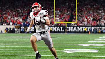 INDIANAPOLIS, INDIANA - JANUARY 10: Brock Bowers #19 of the Georgia Bulldogs carries the ball into the endzone for a touchdown in the fourth quarter of the game against the Alabama Crimson Tide during the 2022 CFP National Championship Game at Lucas Oil Stadium on January 10, 2022 in Indianapolis, Indiana. (Photo by Emilee Chinn/Getty Images)