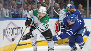 TORONTO, CANADA - OCTOBER 20: Jason Robertson #21 of the Dallas Stars skates with the puck against a checking Morgan Rielly #44 of the Toronto Maple Leafs in the third period during an NHL game at Scotiabank Arena on October 20, 2022 in Toronto, Ontario, Canada. The Maple Leafs defeated the Stars 3-2 in overtime. (Photo by Claus Andersen/Getty Images)