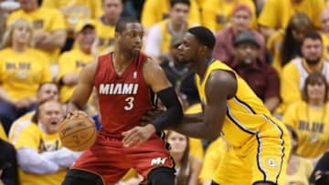 May 18, 2014; Indianapolis, IN, USA; Miami Heat guard Dwayne Wade (3) is guarded by Indiana Pacers guard Lance Stephenson (3) in game one of the Eastern Conference Finals of the 2014 NBA Playoffs at Bankers Life Fieldhouse. Indiana defeats Miami 107-96. Mandatory Credit: Brian Spurlock-USA TODAY Sports