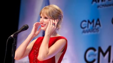 NASHVILLE, TN - NOVEMBER 06: Taylor Swift receives an award at the 47th annual CMA Awards at the Bridgestone Arena on November 6, 2013 in Nashville, Tennessee. (Photo by Sara Kauss/WireImage)