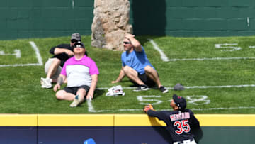 GOODYEAR, ARIZONA - MARCH 12: Oscar Mercado #35 of the Cleveland Indians climbs the center field fence in an attempt to catch a solo home run hit by Max Muncy #13 of the Los Angeles Dodgers during the fifth inning of a spring training game at Goodyear Ballpark on March 12, 2021 in Goodyear, Arizona. (Photo by Norm Hall/Getty Images)