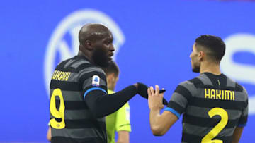 MILAN, ITALY - JANUARY 30: Romelu Lukaku (L) of FC Internazionale celebrates his second goal with his team-mate Achraf Hakimi (R) during the Serie A match between FC Internazionale and Benevento Calcio at Stadio Giuseppe Meazza on January 30, 2021 in Milan, Italy. (Photo by Marco Luzzani/Getty Images)