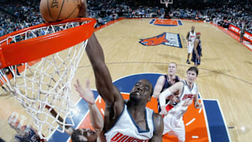 CHARLOTTE, NC - MARCH 28: Emeka Okafor #50 of the Charlotte Bobcats dunks the ball during the game against the New Jersey Nets March 28, 2005 at the Charlotte Coliseum in Charlotte, North Carolina. The Nets defeated the Bobcats 95-91. NOTE TO USER: User expressly acknowledges and agrees that, by downloading and/or using this Photograph, user is consenting to the terms and conditions of the Getty Images License Agreement. (Photo by Streeter Lecka/Getty Images)