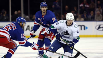 NEW YORK, NEW YORK - FEBRUARY 08: Vincent Trocheck #16 of the New York Rangers and Elias Pettersson #40 of the Vancouver Canucks battle for the puck during the game at Madison Square Garden on February 08, 2023 in New York City. (Photo by Jamie Squire/Getty Images)