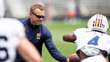 Auburn football head coach Bryan Harsin hands the ball off to Auburn running back Tank Bigsby (4) during warm ups before Auburn football A-Day spring game at Jordan-Hare Stadium in Auburn, Ala., on Saturday, April 17, 2021.