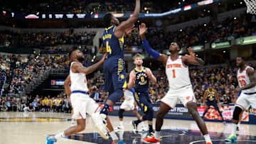 Feb 1, 2020; Indianapolis, Indiana, USA; Indiana Pacers guard Victor Oladipo (4) takes a shot against New York Knicks forward Bobby Portis (1) during the fourth quarter at Bankers Life Fieldhouse. Mandatory Credit: Brian Spurlock-USA TODAY Sports