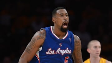Oct 29, 2013; Los Angeles, CA, USA; Los Angeles Clippers center DeAndre Jordan (6) reacts to a dunk as Los Angeles Lakers point guard Steve Blake (5) looks on in the second half of the game at Staples Center. Lakers won 116-103. Mandatory Credit: Jayne Kamin-Oncea-USA TODAY Sports