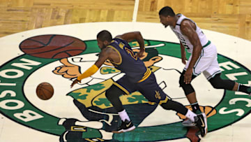 BOSTON - MAY 19: Cleveland Cavaliers player Kyrie Irving steals the ball from Boston Celtics player Marcus Smart at center court. The Boston Celtics hosted the Cleveland Cavaliers in Game Two of their NBA Eastern Conference Finals playoff series at TD Garden in Boston on May 19, 2017. (Photo by Jim Davis/The Boston Globe via Getty Images)