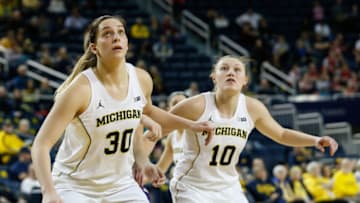 ANN ARBOR, MI - FEBRUARY 08: Michigan Wolverines center Hallie Thome (30) and Michigan Wolverines guard Nicole Munger (10) wait for a rebound during a regular season Big 10 Conference basketball game between the Northwestern Wildcats and the Michigan Wolverines on February 8, 2018 at the Crisler Center in Ann Arbor, Michigan.(Photo by Scott W. Grau/Icon Sportswire via Getty Images)